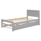 Lit plateforme bas gris de taille jumeau avec lit gigogne coulissant et tête de lit panneau