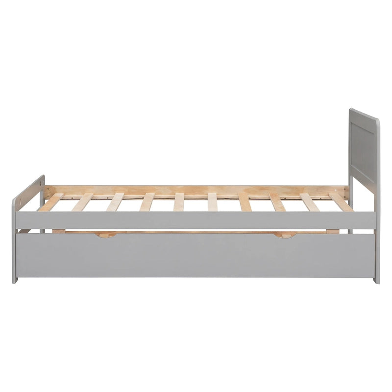 Lit plateforme bas gris de taille jumeau avec lit gigogne coulissant et tête de lit panneau