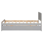 Lit plateforme bas gris de taille jumeau avec lit gigogne coulissant et tête de lit panneau