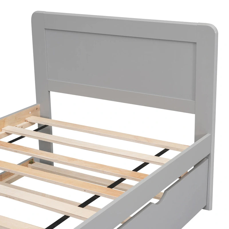 Lit plateforme bas gris de taille jumeau avec lit gigogne coulissant et tête de lit panneau